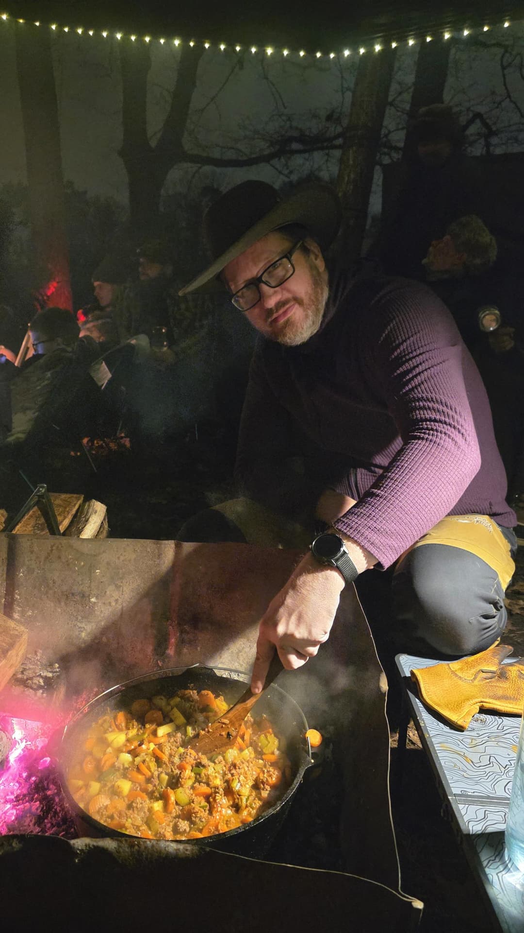 Man cooking a meal on a campfire. Man cooking a meal on a campfire.